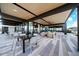 Inviting outdoor patio with comfortable seating, a fireplace, and stylish decor for relaxing or entertaining at 7836 E Quintana Ave, Mesa, AZ 85212