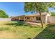Private backyard with covered patio area offering outdoor relaxation and entertainment space at 820 W Hononegh Dr, Phoenix, AZ 85027