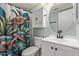 Stylish bathroom with turtle-themed shower curtain, decorative vanity and an updated cabinet at 820 W Hononegh Dr, Phoenix, AZ 85027