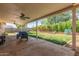 Spacious covered patio overlooking a well-maintained backyard, perfect for outdoor entertaining and relaxation at 820 W Hononegh Dr, Phoenix, AZ 85027