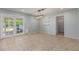 Bright dining area with tile flooring, modern light fixture, and access to the backyard at 820 W Hononegh Dr, Phoenix, AZ 85027