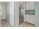 Hallway showing extra storage cabinets and a bedroom with a ceiling fan at 820 W Hononegh Dr, Phoenix, AZ 85027