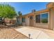 Inviting single-story home featuring desert landscaping, a well-lit walkway, and a cozy front porch with security door at 820 W Hononegh Dr, Phoenix, AZ 85027