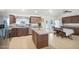 Spacious kitchen featuring an island, tile flooring, and ample cabinet space at 8343 W Calle Lejos --, Peoria, AZ 85383