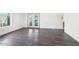 Living area featuring hardwood floors and French doors leading to the outside at 8343 W Calle Lejos --, Peoria, AZ 85383