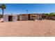 A gravel backyard featuring a storage shed and ample room for customization at 8632 E Delilah Ave, Mesa, AZ 85208