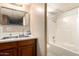 Bathroom with double sinks, white countertops, and bath and shower combination at 8632 E Delilah Ave, Mesa, AZ 85208