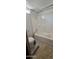 Bathroom with tub and shower combo and safety seat at 8632 E Delilah Ave, Mesa, AZ 85208