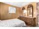 Bedroom featuring wooden furniture, including a dresser with ornate mirrors at 8632 E Delilah Ave, Mesa, AZ 85208