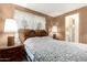 Inviting bedroom with a cozy bed, bedside tables, and soft lighting at 8632 E Delilah Ave, Mesa, AZ 85208