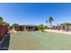 Spacious front yard with well-maintained lawn, mature trees, and landscaping features at 8632 E Delilah Ave, Mesa, AZ 85208
