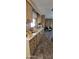 Kitchen featuring countertops, wooden cabinets and tile flooring at 8632 E Delilah Ave, Mesa, AZ 85208