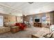 Bright and airy living room featuring a dining area, large mirror wall, and comfortable seating at 8632 E Delilah Ave, Mesa, AZ 85208