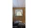 Window with curtains in a room with wood paneling at 8632 E Delilah Ave, Mesa, AZ 85208