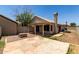 Private backyard with a patio, tiled roof, and fire pit feature at 9002 W Caribbean Ln, Peoria, AZ 85381