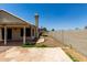 Backyard showcasing pavers and tiled roof, partially enclosed with a block wall at 9002 W Caribbean Ln, Peoria, AZ 85381