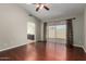 Spacious bedroom with hardwood floors and access to an ensuite bathroom at 9002 W Caribbean Ln, Peoria, AZ 85381