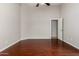 Good sized bedroom with hardwood floors and an entry door at 9002 W Caribbean Ln, Peoria, AZ 85381