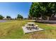 Well-maintained community park featuring picnic seating and lush greenery for neighborhood enjoyment at 9002 W Caribbean Ln, Peoria, AZ 85381