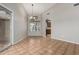 Dining area boasts tiled floors, a chandelier, and a view into the kitchen with natural light at 9002 W Caribbean Ln, Peoria, AZ 85381