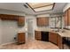 Eat-in kitchen with plenty of cabinet space, tile floors and black appliances at 9002 W Caribbean Ln, Peoria, AZ 85381