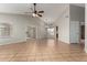 Spacious living room features tiled floors, neutral walls, and a sliding glass door for natural light at 9002 W Caribbean Ln, Peoria, AZ 85381
