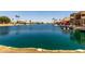 Stunning waterfront view showcasing the tranquil canal and beautiful surrounding homes at 9002 W Caribbean Ln, Peoria, AZ 85381