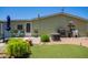 Cozy backyard with patio seating, a grill, and a small grassy area for outdoor relaxation at 9822 E Main St # 4, Mesa, AZ 85207