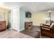 Basement area featuring tile flooring and a comfortable seating area at 9822 E Main St # 4, Mesa, AZ 85207