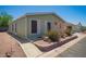 Charming single-story home showcasing desert landscaping and mature bushes at 9822 E Main St # 4, Mesa, AZ 85207