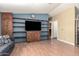 Spacious living room features wood-look flooring and wooden built-ins at 9822 E Main St # 4, Mesa, AZ 85207