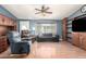 Cozy living room with wood flooring, ceiling fan and built-in shelves at 9822 E Main St # 4, Mesa, AZ 85207
