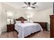 A spacious primary bedroom with a ceiling fan, and wooden furniture at 9822 E Main St # 4, Mesa, AZ 85207