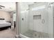 This bathroom features a glass enclosed shower, a rain shower head, and easy access to the main bedroom at 1005 E Weldon Ave, Phoenix, AZ 85014
