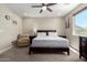 Relaxing bedroom with a ceiling fan and natural light from the window, creating a serene atmosphere at 1005 E Weldon Ave, Phoenix, AZ 85014