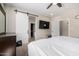 Bedroom features sliding door for the closet, TV and access to other parts of the house at 1005 E Weldon Ave, Phoenix, AZ 85014