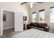 Spacious bedroom features a ceiling fan, natural light from the windows, and comfortable furniture at 1005 E Weldon Ave, Phoenix, AZ 85014