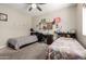 Bedroom featuring two twin beds, a desk, and a ceiling fan at 1005 E Weldon Ave, Phoenix, AZ 85014