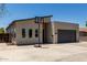 Contemporary home featuring a gray garage door, sleek lines, and an inviting front exterior with a basketball hoop at 1005 E Weldon Ave, Phoenix, AZ 85014