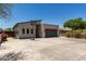 Contemporary home featuring a gray garage door, sleek lines, and an inviting front exterior with a basketball hoop at 1005 E Weldon Ave, Phoenix, AZ 85014