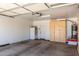 Spacious garage with built in cabinets, water heater, and a refrigerator at 1005 E Weldon Ave, Phoenix, AZ 85014