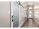 Hallway featuring wood-look tile flooring and a modern barn door at 1005 E Weldon Ave, Phoenix, AZ 85014