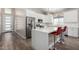 Bright kitchen with a white island, stainless steel appliances, and modern finishes at 1005 E Weldon Ave, Phoenix, AZ 85014