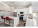 Well-lit kitchen featuring a large island with seating and modern appliances at 1005 E Weldon Ave, Phoenix, AZ 85014