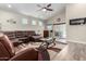 Comfortable living room featuring vaulted ceilings, a ceiling fan, and access to the pool at 1005 E Weldon Ave, Phoenix, AZ 85014