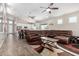 Spacious living room with modern decor, a large sofa, and access to the kitchen at 1005 E Weldon Ave, Phoenix, AZ 85014