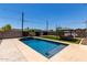 Backyard featuring a rectangular pool, gazebo, and a privacy wall at 1005 E Weldon Ave, Phoenix, AZ 85014