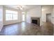 Living room with tile flooring, neutral paint colors, fireplace, ceiling fan, and lots of natural light at 11375 E Sahuaro Dr # 1053, Scottsdale, AZ 85259
