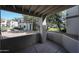 Covered patio offers privacy wall, tan stucco, concrete patio, and landscape views at 11375 E Sahuaro Dr # 1053, Scottsdale, AZ 85259