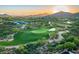 Scenic aerial view of a golf course community with lush landscaping, mountain views, and a serene ambiance at 11548 E Salero Dr, Scottsdale, AZ 85262